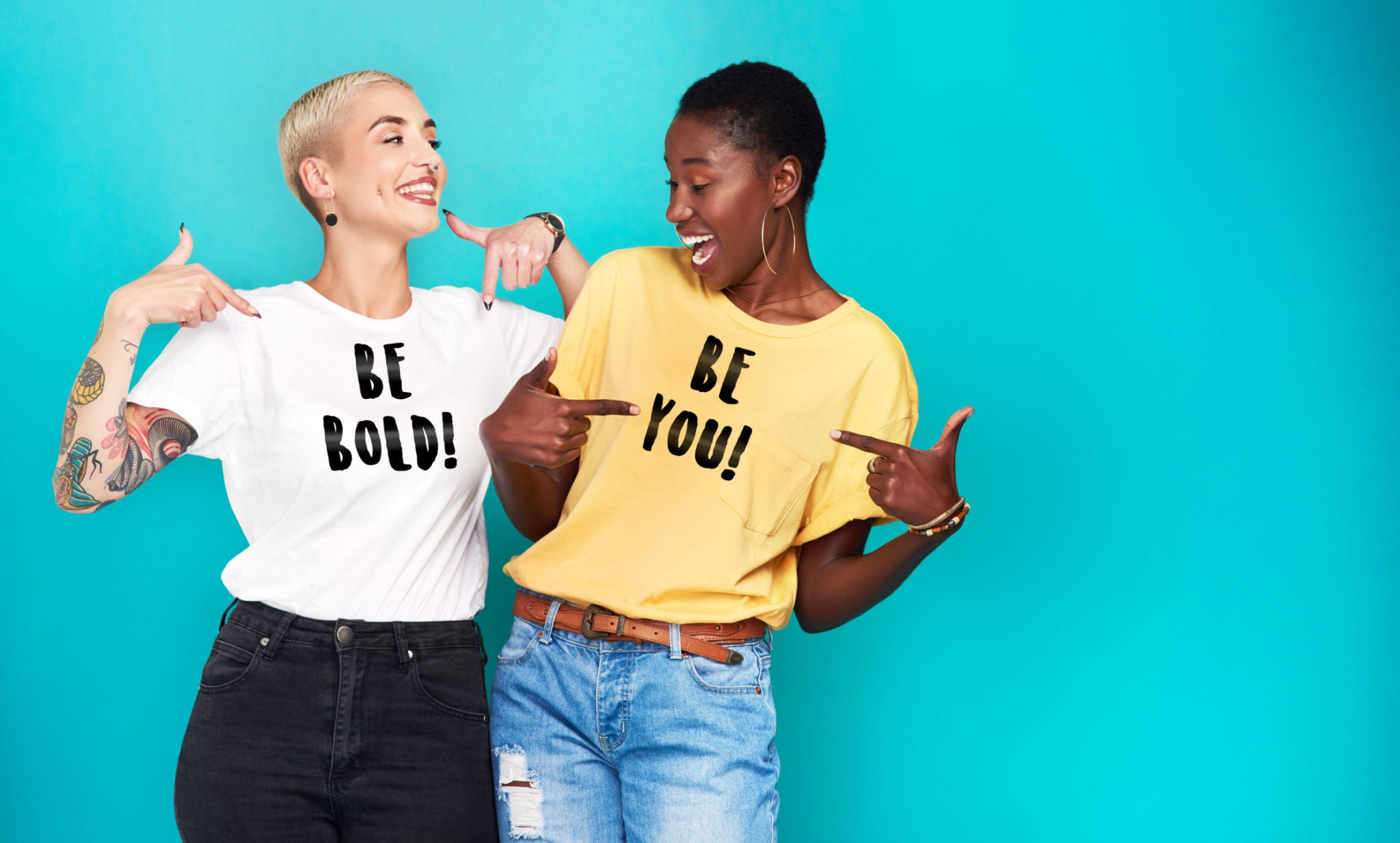 two ladies with t-shirts that say be bold and be you
